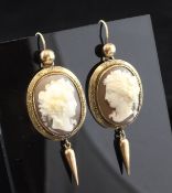 A pair of Victorian gold mounted cameo drop earrings, each carved with the bust of a lady, one to