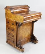 A Victorian walnut piano top davenport, with slide out fitted interior, with four side drawers