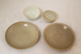 Two Chinese Yue ware dishes and a Dehua teabowl, Tang / Ming dynasty, the two Tang dishes moulded