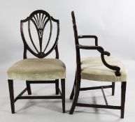 A set of six Hepplewhite style mahogany dining chairs, with shield shape backs, serpentine