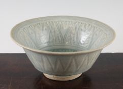 A Thai Sawankhalok celadon glazed deep bowl, 14th / 15th century, of unusual form with a carved