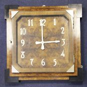 An Art Deco walnut and ebony wall timepiece, with glazed arabic dial and Smiths electric movement,