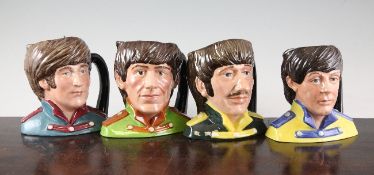 A set of four Royal Doulton `Beatles` character jugs, modelled by Stanley James Taylor, c.1984, `