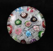 A Clichy spaced millefiori glass paperweight, mid 19th century, with complex canes including a