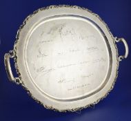 A Mexican white metal two handled tray, with scroll rim and presentation inscription dated 1956,