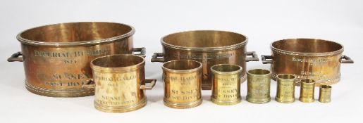 A graduated set of ten George IV bronze imperial capacity measures, bushel to half gill, all