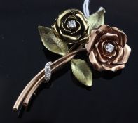 A three colour 14ct gold and diamond set rose brooch, 2.25in.