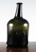 An English glass sealed magnum wine bottle, c.1790, of squat cylindrical form, bearing the seal for