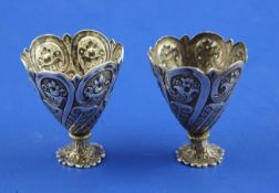A pair of early 20th century Turkish silver zarfs, with embossed foliate decoration, Tughra mark,
