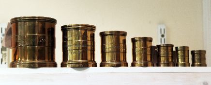 Seven 19th century bronze imperial capacity measures, includes a graduated set of five marked for