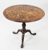 A circular mahogany and marquetry inlaid tripod table, with bird cage movement, on vase turned