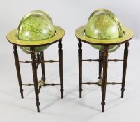 A pair of Georgian style 12 inch terrestrial and celestial library globes, on tapering fluted