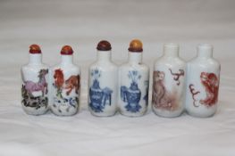 Three Chinese porcelain double snuff bottles, 1800-1900, the first painted in famille rose enamels