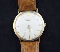 A gentleman`s early 1960`s 9ct gold Longines manual wind wrist watch, with baton numerals and