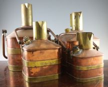 Four graduated De Grave Short & Co copper and brass petrol measures, with spirit levels and glass