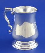 A George III silver baluster mug, with acanthus scroll handles and later engraved monogram, William
