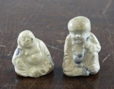 Two Chinese Ming blue and white miniature figures, the first modelled as a seated man holding a