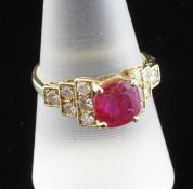 A gold, ruby and diamond dress ring, with rounded rectangular cut ruby and brilliant cut diamond