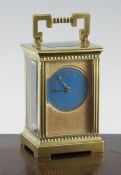 An Edwardian brass carriage timepiece, with blue arabic dial, 5in.
