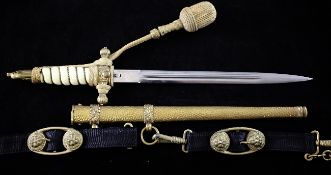 A German WWII naval dagger, with Portepee wire bound grip, eagle pommel and hammered scabbard with