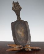 A West African Yoruba Shango staff, carved with four stylised masks, 13in., and a West African