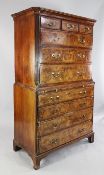 An 18th century walnut chest on chest, fitted three small drawers over three long graduated drawers