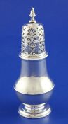 A George II silver baluster caster, of plain form with bird and shell crest, Richard Gosling, 1733,