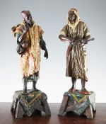 A pair of late 19th / early 20th century cold painted spelter figures of Arab street traders, 17.