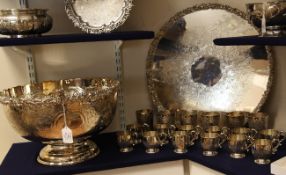 A large 20th century silver plated punch bowl on stand with six matching goblets and twelve
