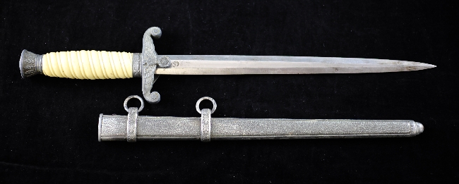 A Third Reich army officer`s dagger, WKC Solingen with white plastic grip and patterned grey metal