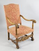A Louis XIV style carved beech open armchair, with patterned red and gold upholstered back and