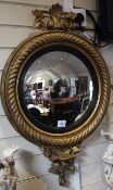 A Regency circular gilt convex wall mirror, with rope twist border and acanthus crest, L.2ft 10in.