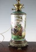 A 19th century Paris porcelain oil lamp decorated with dogs in a landscape, 15in.