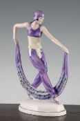 Josef Lorenzl for Goldscheider. `The Arabian Dancer` pottery figure, c.1925, in purple costume, on