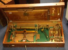 An Edwardian lacquered brass beam scale set, by De Grave & Co, includes 7lb beam scale and 1lb beam