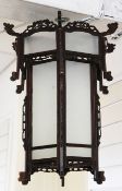 A Chinese rosewood hexagonal hanging lantern, with frosted glass panels and projecting dragon