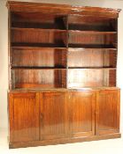 A 19th century mahogany library bookcase, fitted with six open adjustable shelves over four
