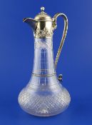 A Victorian silver mounted cut glass claret jug, of tapering form with bulbous base, the mount with