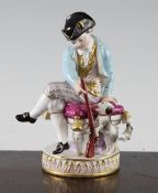 A Meissen group of a boy and his dog, late 19th century, the boy seated on a stool holding a rifle