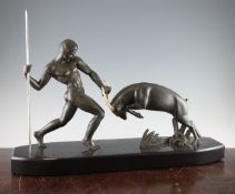 A French Art Deco bronzed spelter and ivorine group of a warrior fighting an antelope, signed