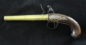 A mid 18th century flintlock pistol by Robert Wilson, with brass canon style barrel and silver