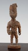 Thomas Ona (Nigerian c.1901-52). A colonial carved hardwood military figure, with fez and sergeant