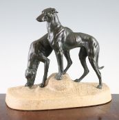 A French Art Deco bronzed spelter and stone group of two hounds upon a rock, signed, 13in.