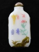 A Chinese five colour overlay white glass snuff bottle, Yangzhou, 1820-1850, well carved in green,