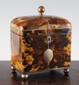 A 19th century blonde tortoiseshell tea caddy, with two division lidded interior, silver escutcheon