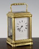 A 19th century French Margaine gilt brass hour repeating carriage clock, with enamelled Roman dial