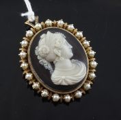 A gold and cultured pearl mounted black onyx cameo pendant brooch, of oval form carved with head of