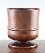 An 18th century turned yew wood wassail bowl, with girdle moulding and circular base