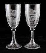A pair of etched `fish` wine glasses, in the manner of Webb, each on a folded foot, 8in.