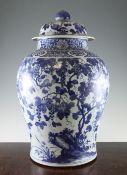 A large Chinese blue and white baluster jar and cover, 19th century, painted in the Kangxi style